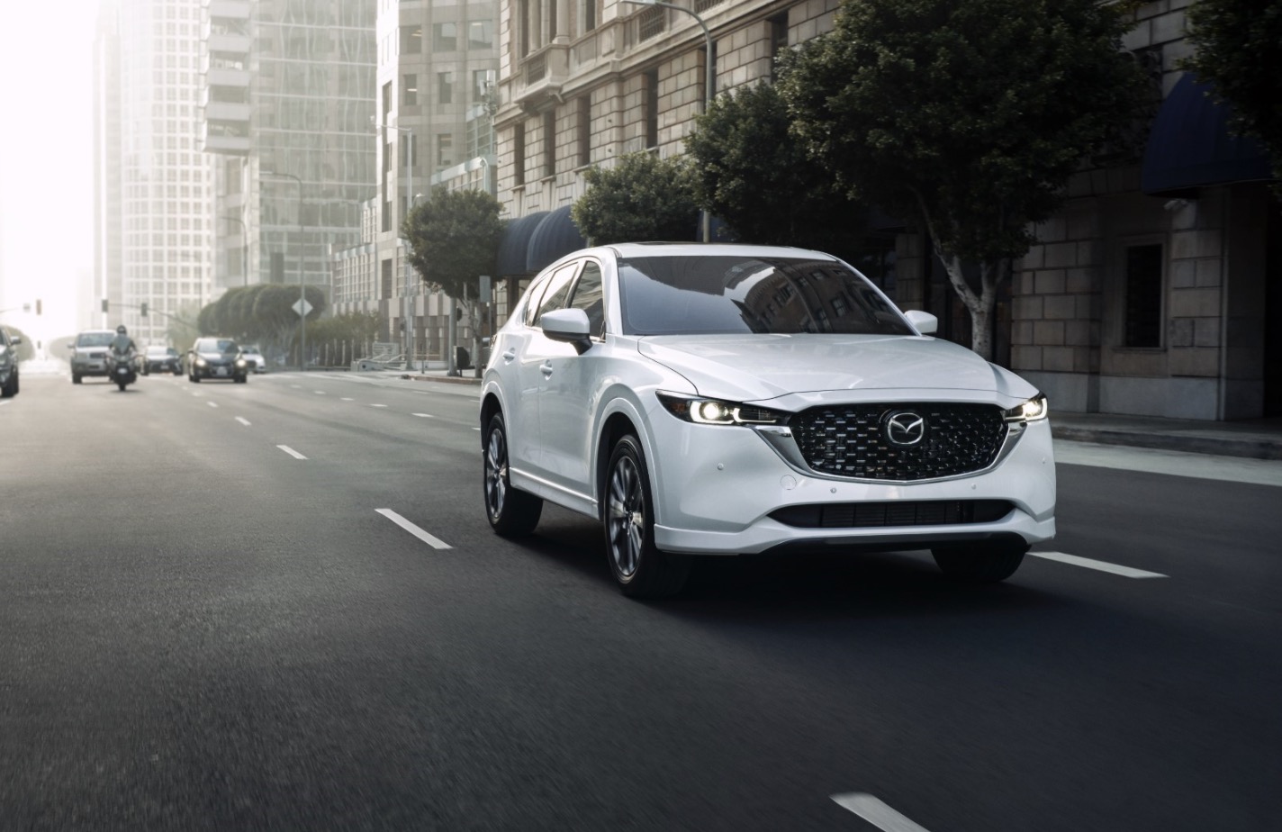 White Mazda CX-5 Driving in the City