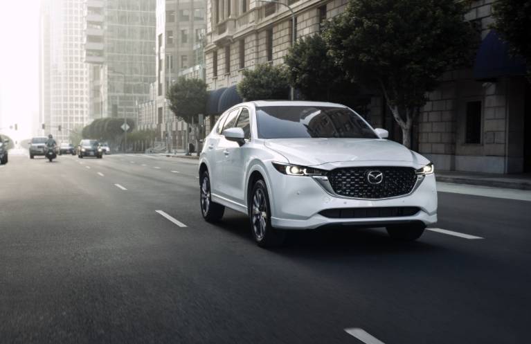 White Mazda CX-5 Driving in the City