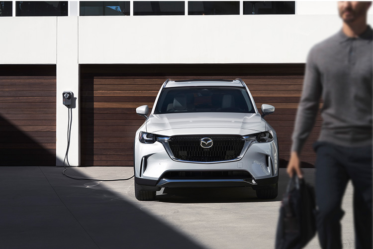 How Long Does It Take to Charge an Electric Car? – Mazda CX-90 PHEV Charging Outside Garage