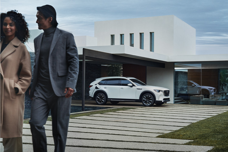 Electric Car Maintenance 101 – Mazda CX-90 PHEV Parked Outside House